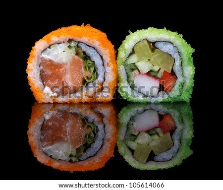 sushi with flying fish eggs, glass reflection