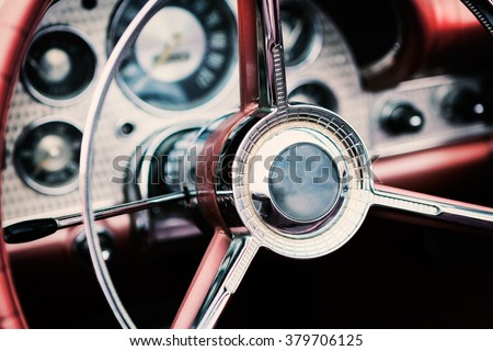 Classic car interior with close-up on steering wheel
