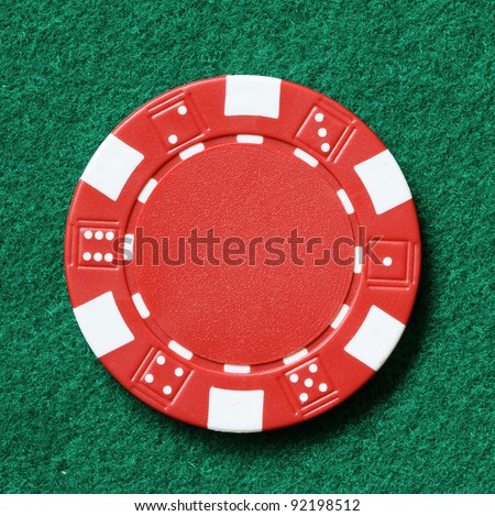 red poker chip on a table