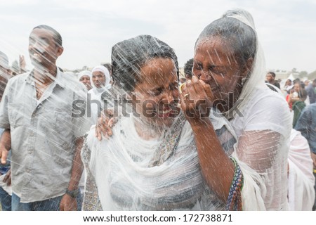 Addis Ababa - Jan 19: Holy water is sprayed onto the crowd attending Timket celebrations of Epiphany, commemorating the baptism of Jesus, on January 19, 2014 in Addis Ababa.
