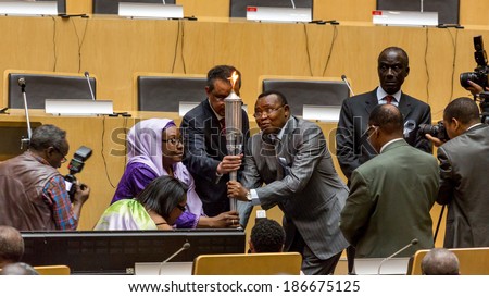 ADDIS ABABA, ETHIOPIA - April 11, 2014: Officials light the \