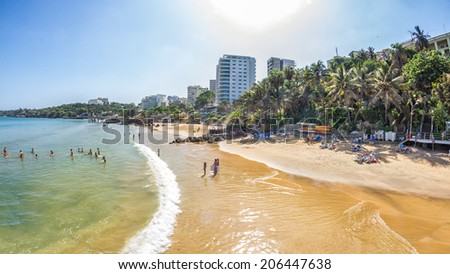Dakar, Senegal - July 2014: Tourists and the local residents of Dakar spend their holidays on the beautiful beaches on July 11, 2014 in Dakar, Senegal