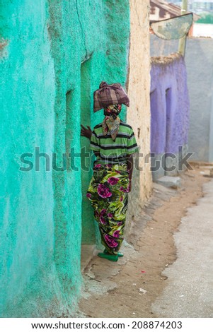 HARAR, ETHIOPIA - JULY 26,2014 - Local residents of Jugol, the fortified historic walled city in the UNESCO World Heritage List considered as the fourth holy city of Islam.