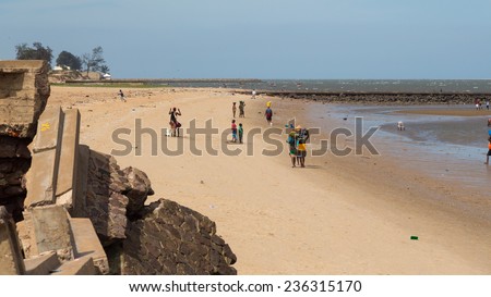 Maputo - Nov 27: The local residents of Maputo collect shellfish along the beach of Maputo Bay - Maputo, Mozambique, November 27, 2014
