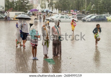 Addis Ababa: Apr 10:Ethiopian Orthodox followers stand undeterred by the pouring rain to observe Siklet, the crucifixion of Jesus Christ, a Medhane Alem Church on Apr 10 ,2015 in Addis Ababa, Ethiopia