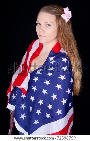 A Curious And Sexy Woman With The American Flag Wrapped And Drapped Over Her Shoulders Stock