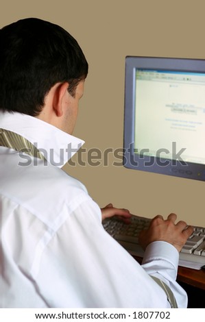 A young businessman browsing on internet (with clipping path).