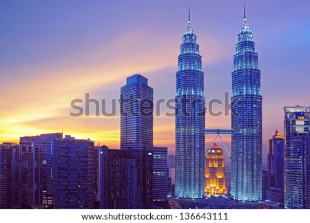 Kuala Lumpur, Malaysia - May 19: Petronas Twin Towers At Twilight On May 19, 2012 In Kuala Lumpur. Petronas Twin Towers Are Twin Skyscrapers And Were Tallest Buildings In The World From 1998 To 2004.