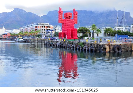 CAPE TOWN, SOUTH AFRICA - APRIL 7: Giant statue made from 4,200 Coca-Cola crates  on April 7, 2012 in Cape Town. This crate man was designed by Porky Hefer to realize the importance of recycling.