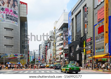 TOKYO, JAPAN - JULY 27: Crowds of people in the center of Shibuya in July 27 2013. It is the most popular commercial center in Tokyo, Japan.