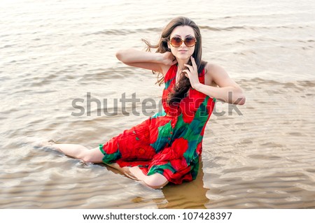summer theme with a beautiful girl at the seaside