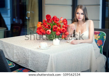 beautiful girl is waiting for him in the coffee