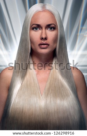 Portrait of a beautiful blonde with a long futuristic hair