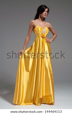 Woman in golden yellow dress