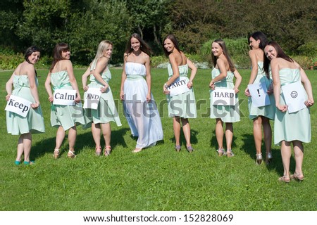 Group of young girl models holding a message \