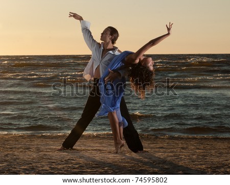 stock-photo-young-couple-dancing-tango-on-the-beach-74595802.jpg