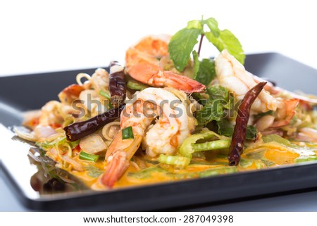 Spicy salad Shrimp with lemon grass and mint on black dish