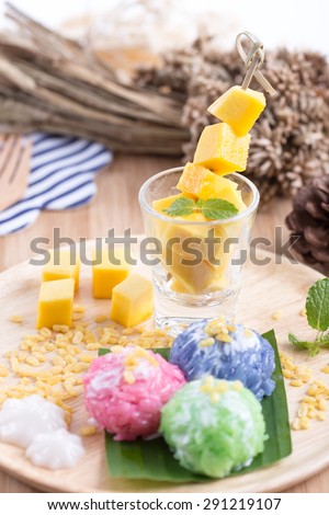 Mango with colorful stick rice and coconut milk
