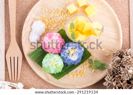 Mango with colorful stick rice and coconut milk