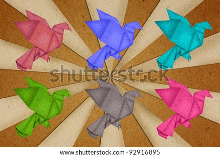 paper birds on brown paper background