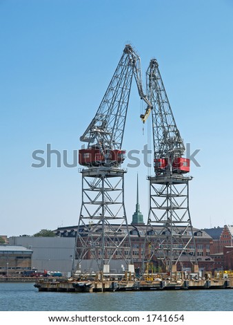 Heavy marine cranes and church, Helsinki