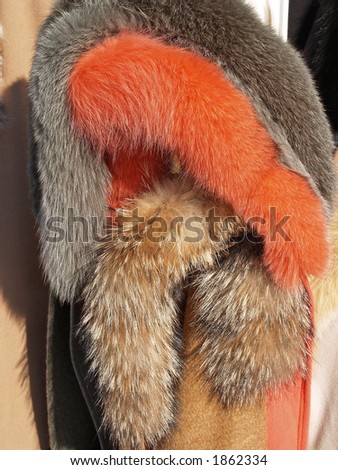Colorful woman caps from fox fur, close-up