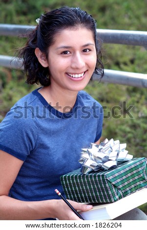 student with book and gift