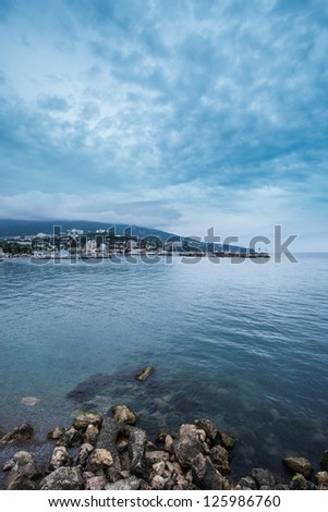 Summer view seacoast. Warm sea and beautiful nature. Yalta beach. Black Sea, Ukraine