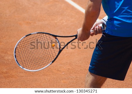 A tennis player waiting for a serve during a match
