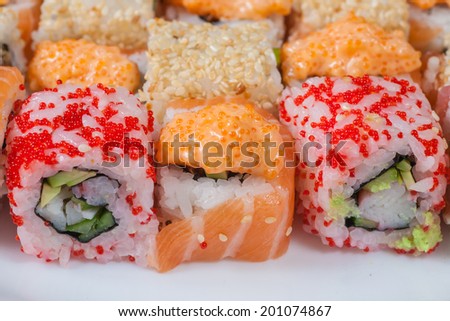 set of Japanese sushi on a white plate