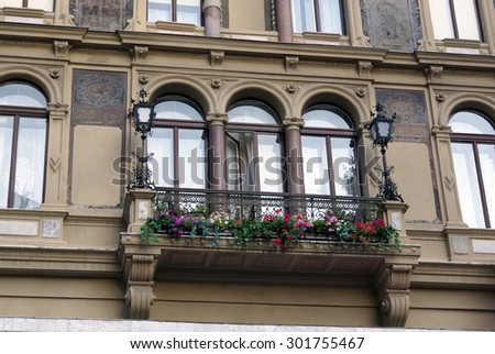 Beautiful Balcony with geraniums hang-downing on an old house, Vienna