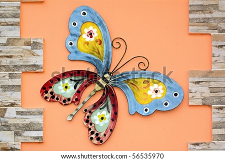 Painting  House on Decorative Painted Butterfly On The Outside Wall Of The House Stock