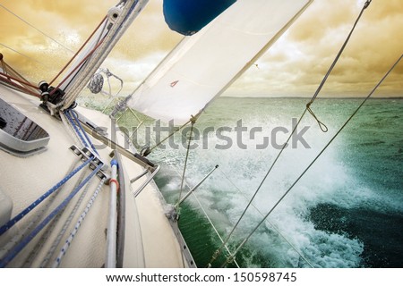 Sailing fast on port tacks with water splashing on deck