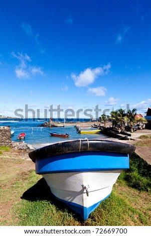 Small blue and white boat in Hanga Roa harbour in Easter Island