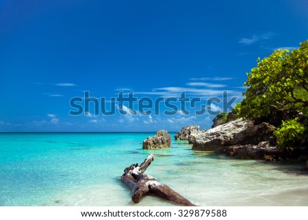 Caribbean island. Beautiful uninhabited island in the Caribbean Sea. The beautiful nature, incredible scenery. The sea breeze. Tropical Island Paradise. tropical beach with turquoise water