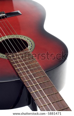 View of a classic (spanish) guitar from the top of the fretboard. Isolated on white.