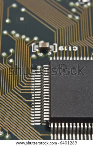 A dark microprocessor on a circuit board.