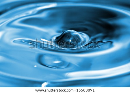 Center of water splash with a very large amplification. The focus is located right at the center and the depth of field is shallow.