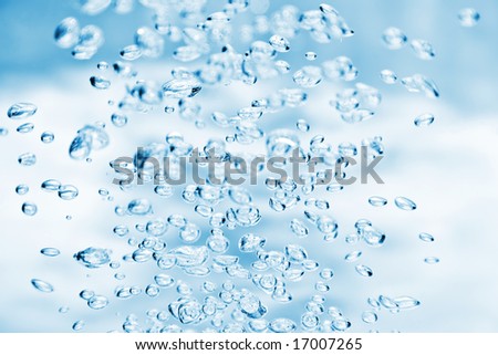Water bubbles in water, light-blue tinted.
