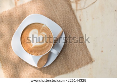 Heart drawing on latte art coffee cup