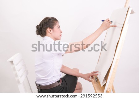 female artist drawing in studio