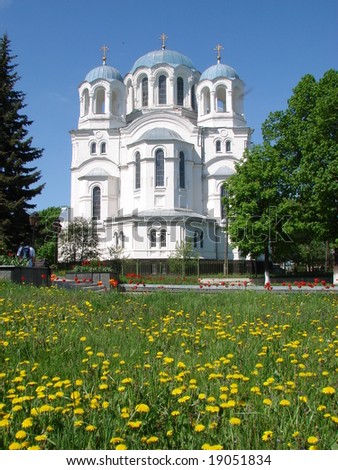 Orthodox Cathedral with wide dandelion meadow in Glukhiv, Ukraine