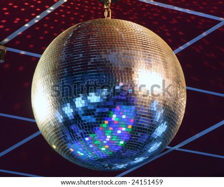 night club lighting blue mirror-ball over curtains