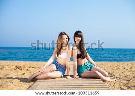 Young girls on vacation by the sea