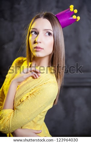 Young majestic woman in crown. Portrait of queen