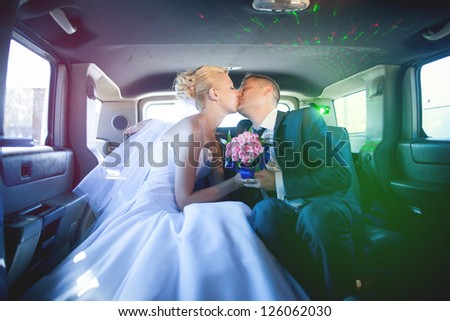 wedding couple in limousine