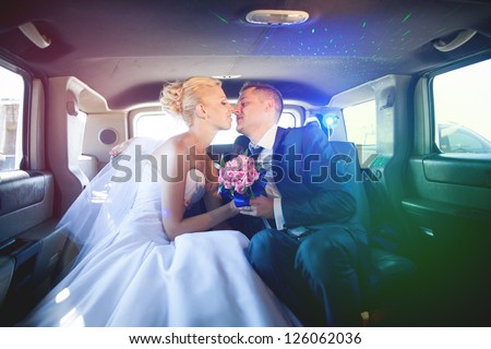 wedding couple in limousine