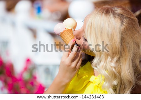 girl eating cone ice cream on summer vacation