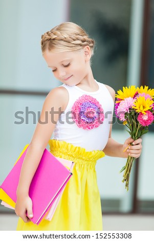 Education - funny girl with a book and flowers
