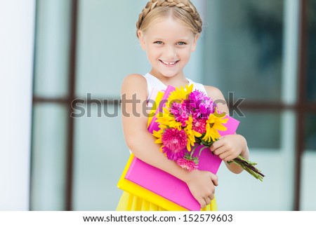 Education - funny girl with a books and flowers